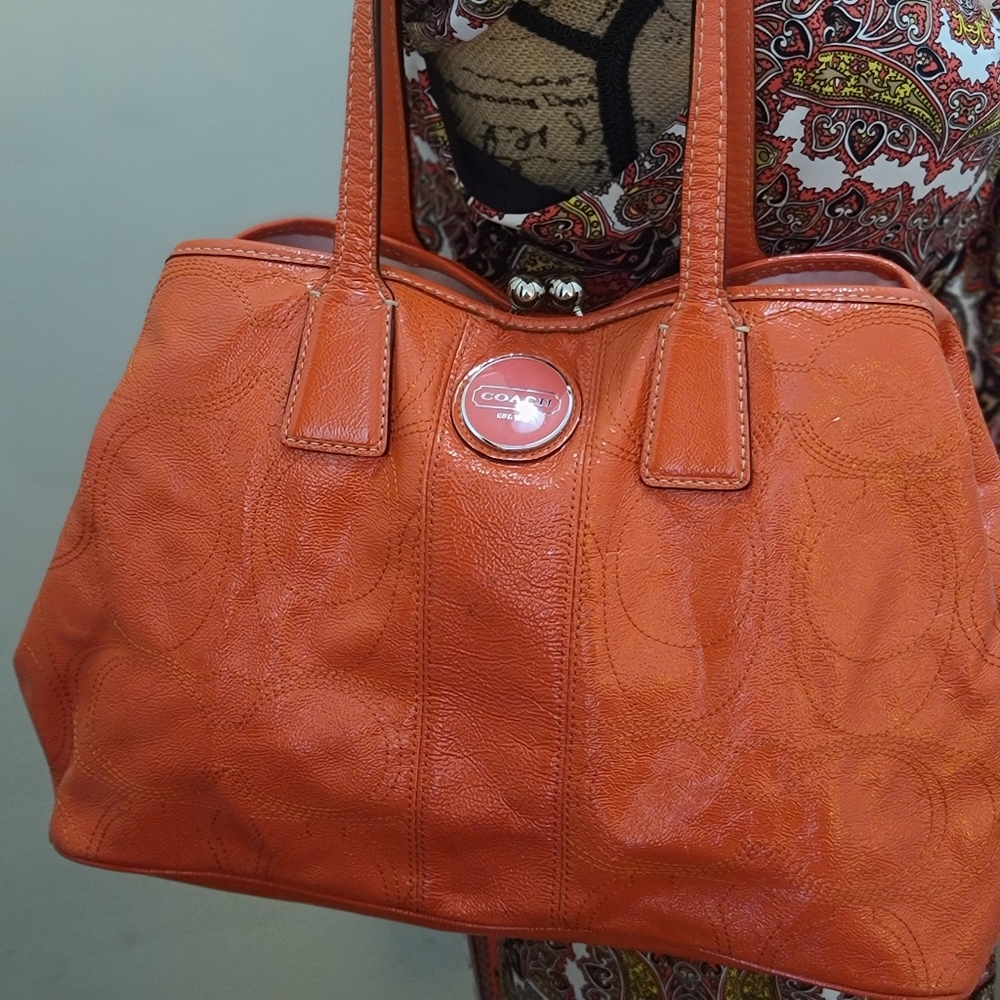 Coach patent leather peachy orange signature